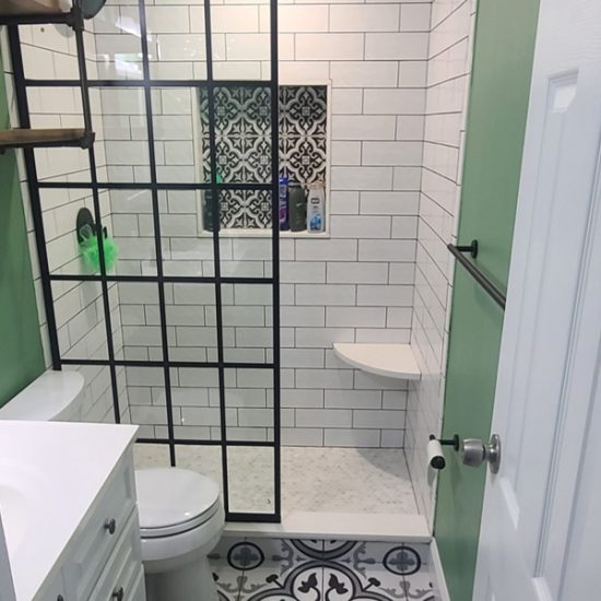 Modern bathroom with patterned tiles.