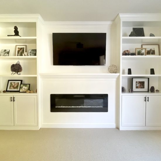 Modern white entertainment center with fireplace