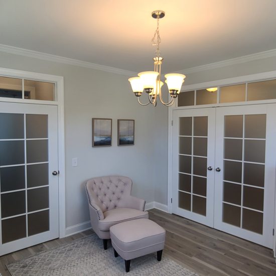 Elegant office with frosted glass doors.