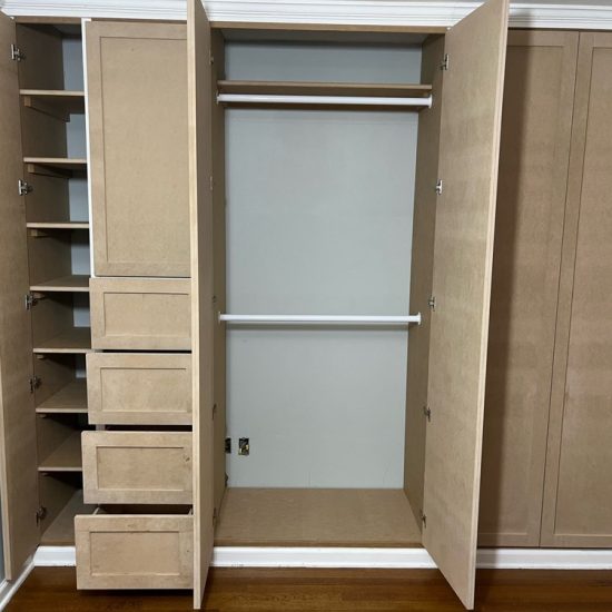 Empty closet with shelves and drawers