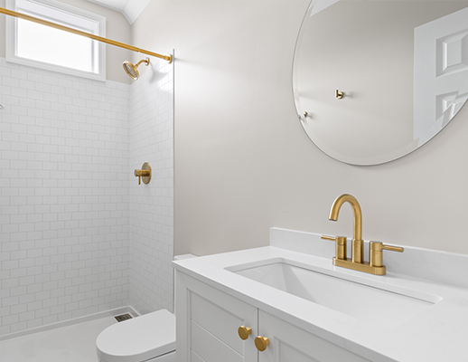 Modern bathroom with gold fixtures