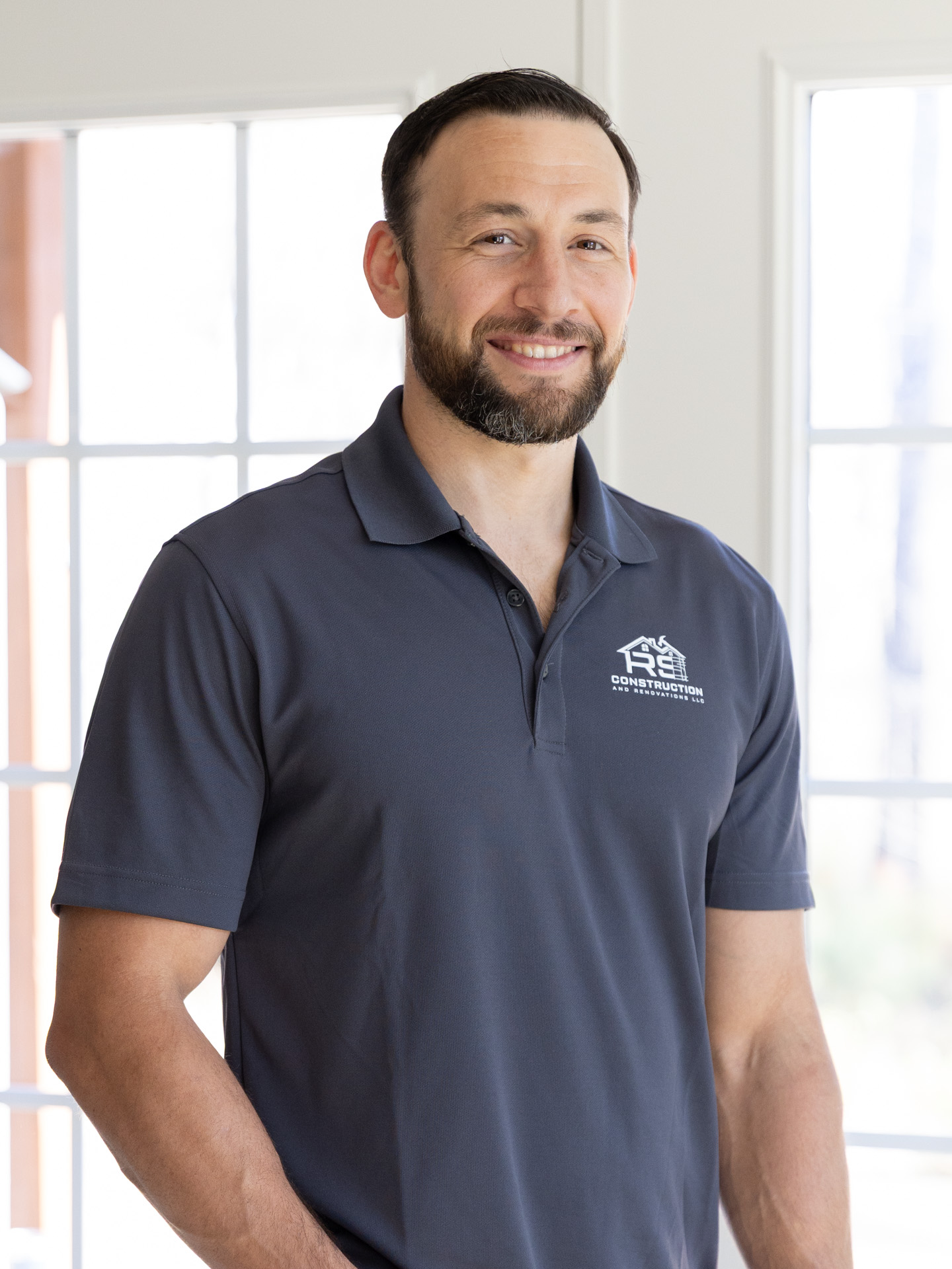 a man smiling at camera